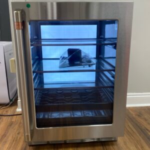 CAFÉ ENERGY STAR 126-Can or 14-Bottle Built-In Beverage Center. This smart, 24-inch under-counter unit holds up to 126 cans, has space for 14 wine bottles, and features an LED light wall and a tuckaway shelf for tall items