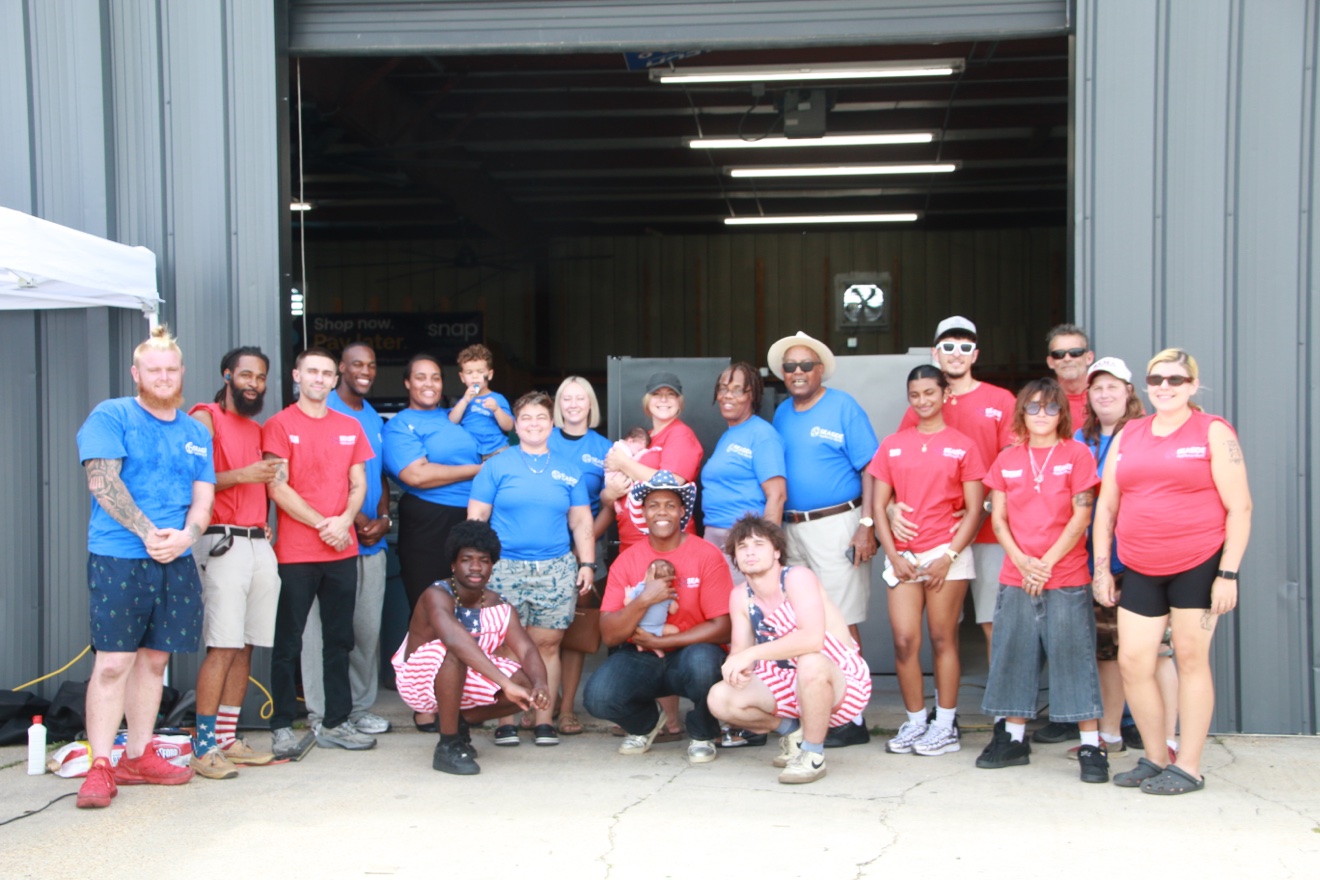 Seaside Appliance World team in front of the Panama City warehouse